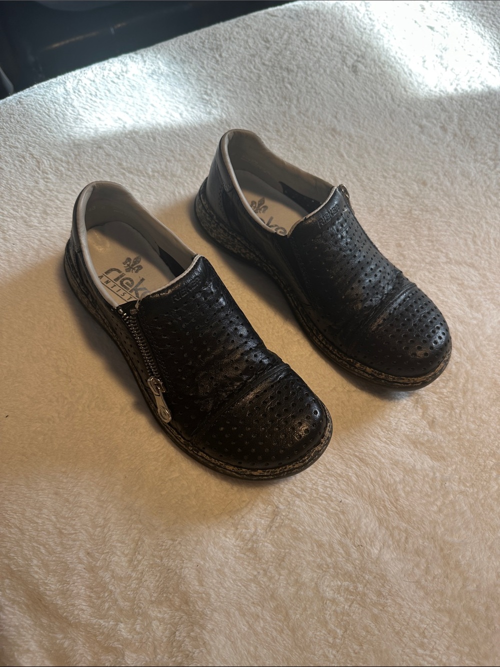 Rieker Black Perforated Zip-Accent Slip-Ons